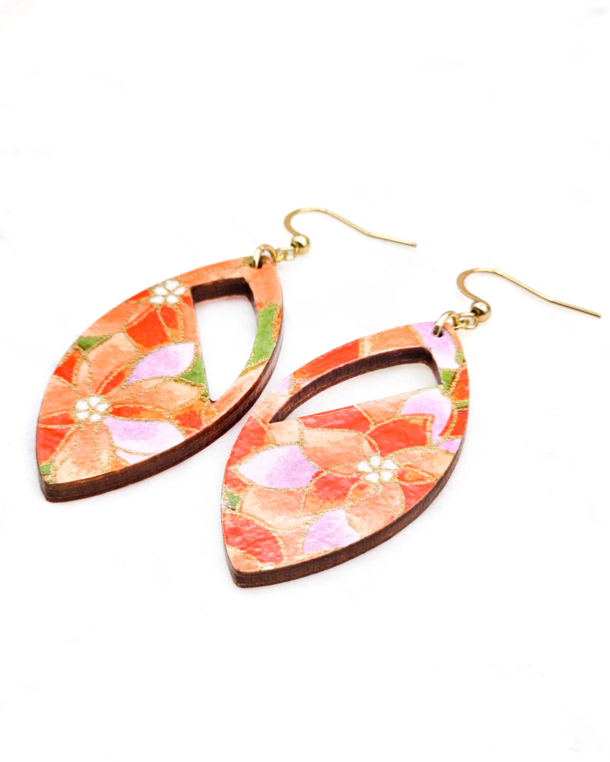 Medium wooden cutout pointed oval shaped earrings featuring orange and purple lotuses on a green background with metallic gold details