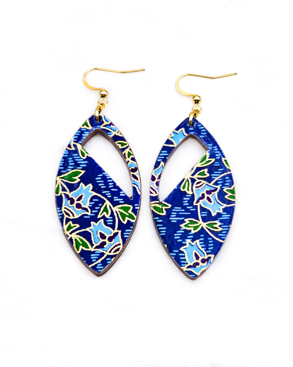 Medium wooden cutout pointed oval shaped earrings featuring blue roses with green leaves on a blue background with metallic gold details