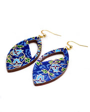 Medium wooden cutout pointed oval shaped earrings featuring blue roses with green leaves on a blue background with metallic gold details