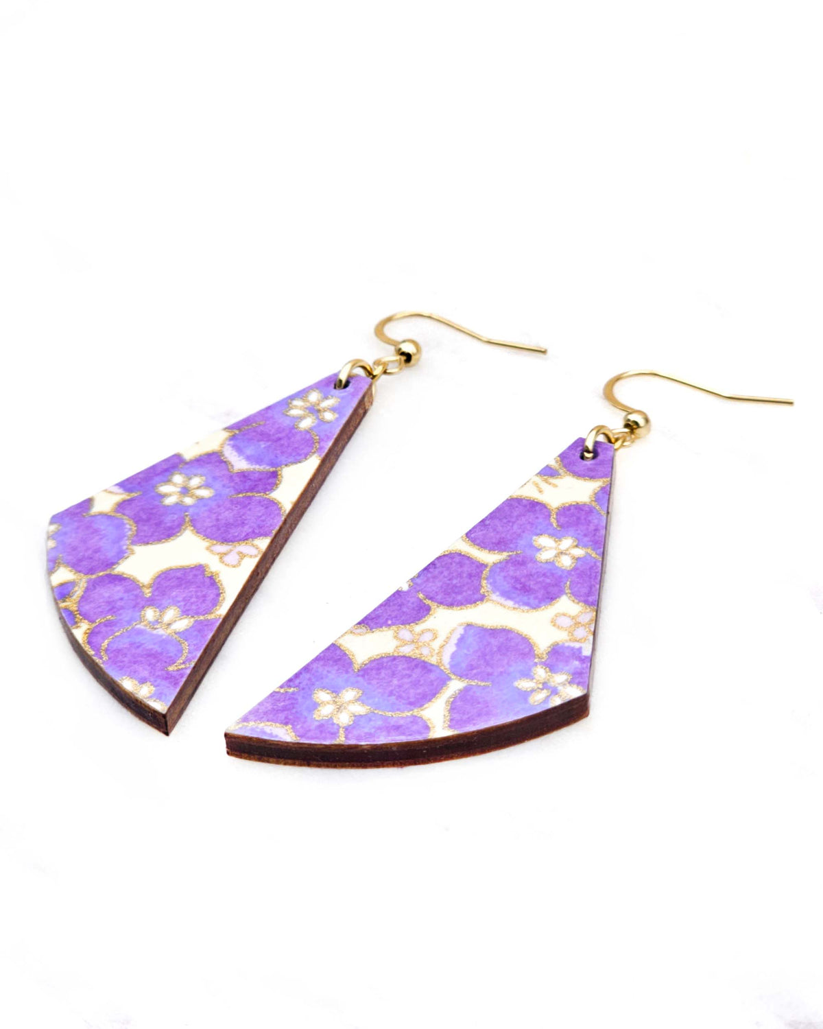 Medium wooden flared drop shaped earrings featuring purple cherry blossoms on a cream background metallic gold details.