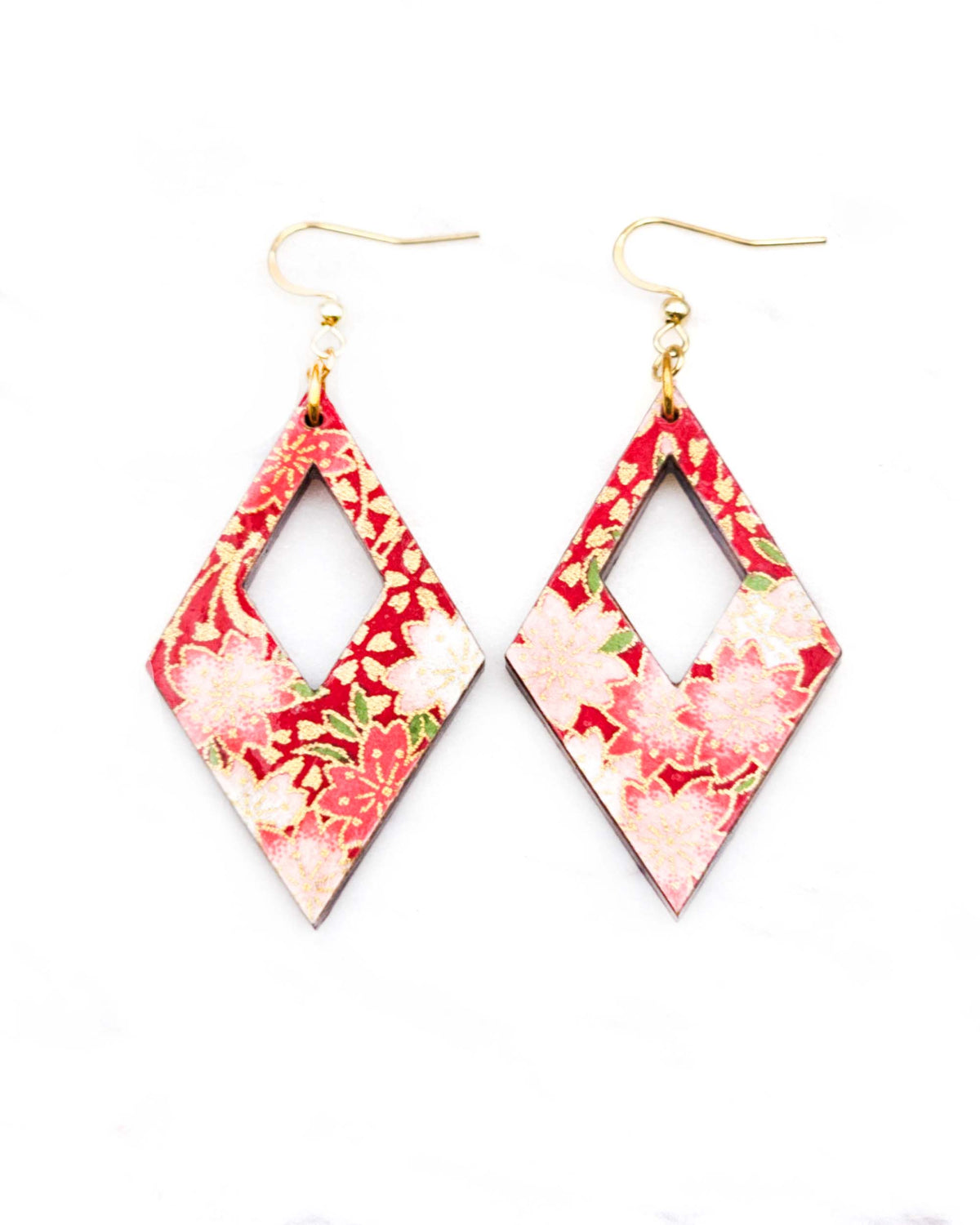 Medium wooden hollow diamond shaped earrings featuring red and white cherry blossoms on a red background with metallic gold details.