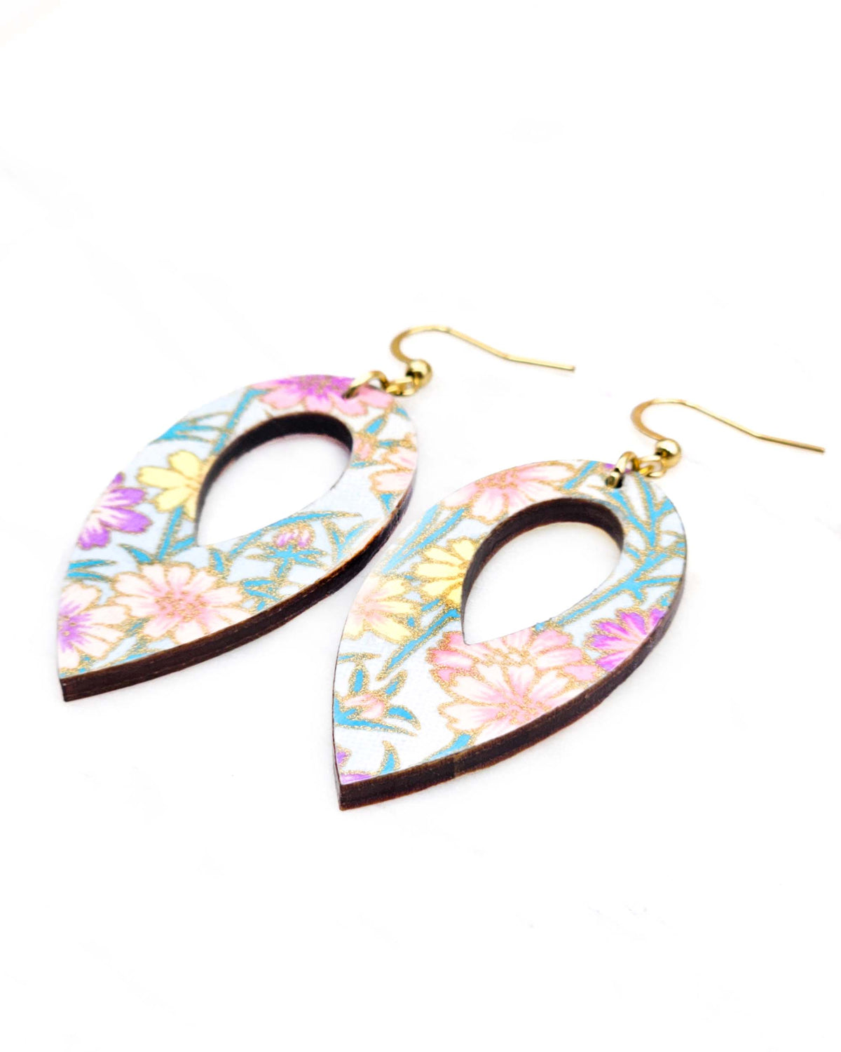 Medium wooden hollow reverse teardrop shaped earrings featuring purple, pink, and yellow flower stalks on a light blue background with metallic gold details