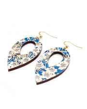Medium wooden hollow reverse teardrop shaped earrings featuring white cherry blossoms on a blue background with metallic gold details