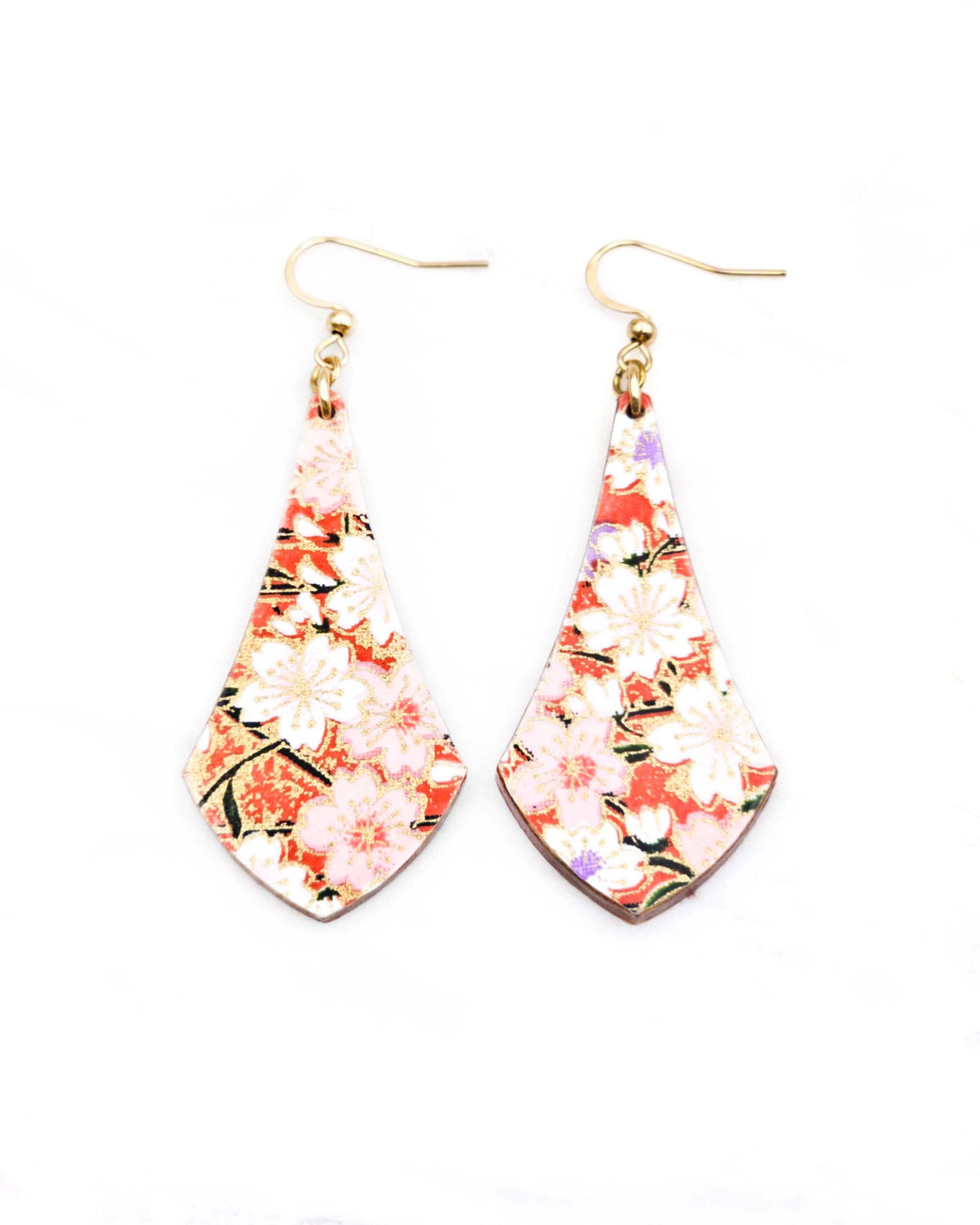 Medium wooden long anchor shaped earrings featuring white and pink cherry blossoms on a reddish orange background with metallic gold details.