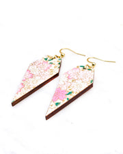 Medium wooden long diamond shaped earrings featuring light pink cherry blossoms a light cream background with metallic gold details.