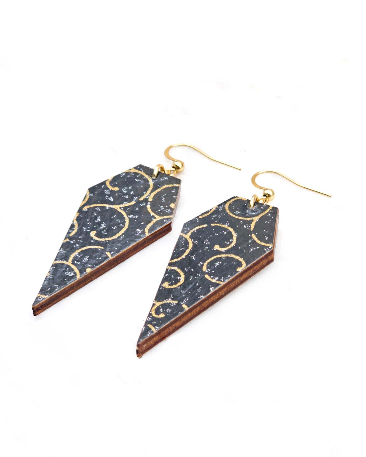 Medium wooden long diamond shaped earrings featuring a metallic gold traditional karakusa design on a black background with silver glitter.