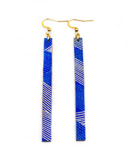 Medium wooden long thin bar shaped earrings featuring a metallic gold and dark green line pattern on a blue background.
