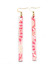 Medium wooden long thin bar shaped earrings featuring pink and white overlapping parasols with metallic gold details.