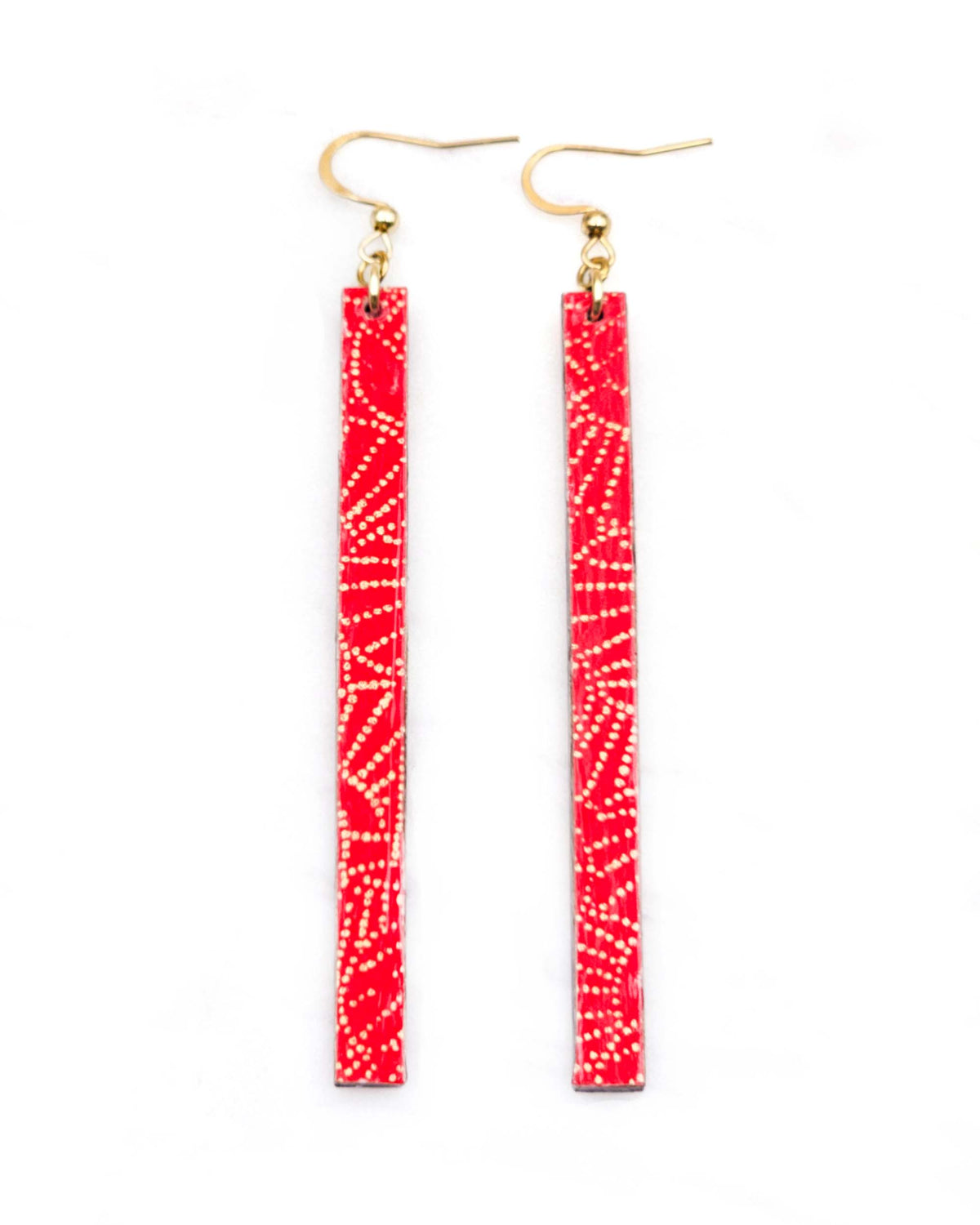 Medium wooden long thin bar shaped earrings featuring small metallic gold pointillistic temari balls on a red background
