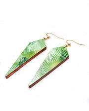 Medium wooden long kite shaped earrings featuring gold, silver, white, and dark green feathery leaves on a green background.