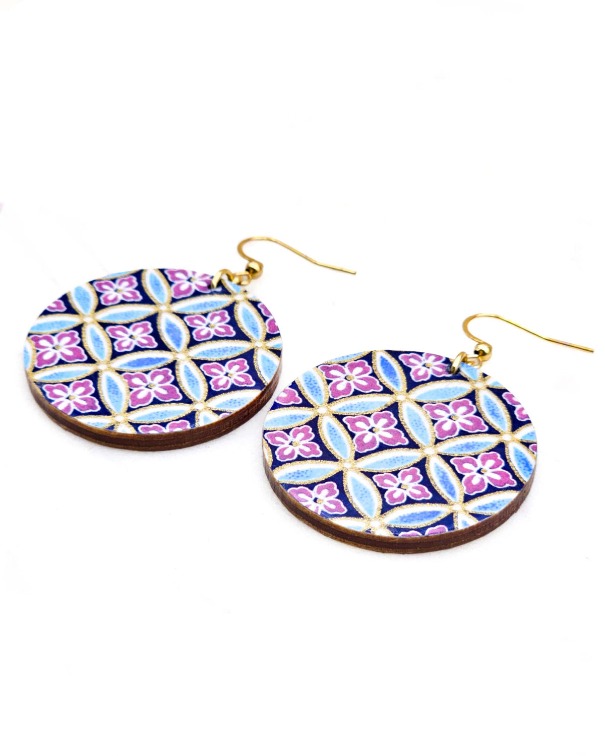 Medium wooden circle shaped earrings featuring a blue shippo design with purple hanabishi in the center with metallic gold details.