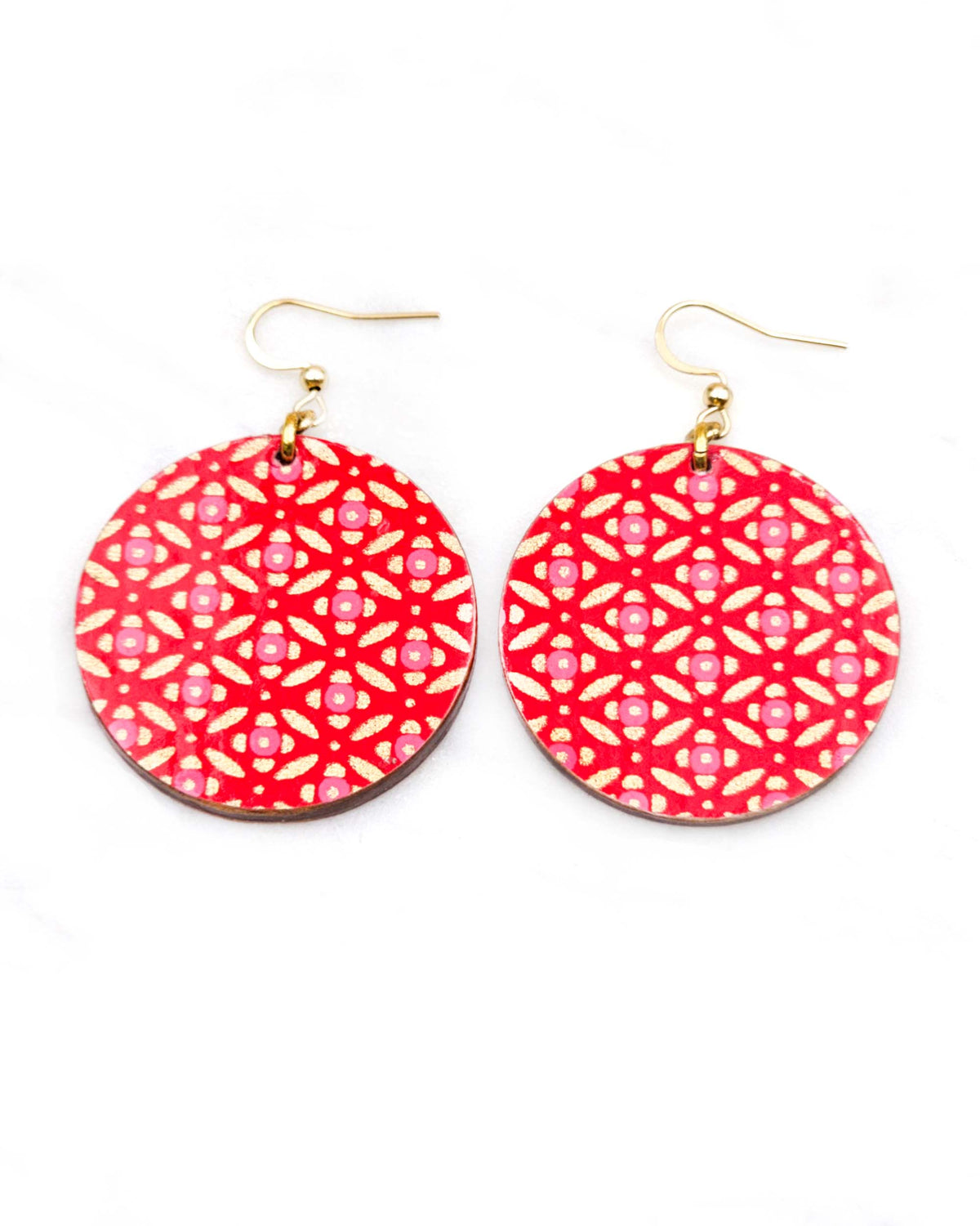 Medium wooden circle shaped earrings featuring a gold shippo design with pink centers on a red background
