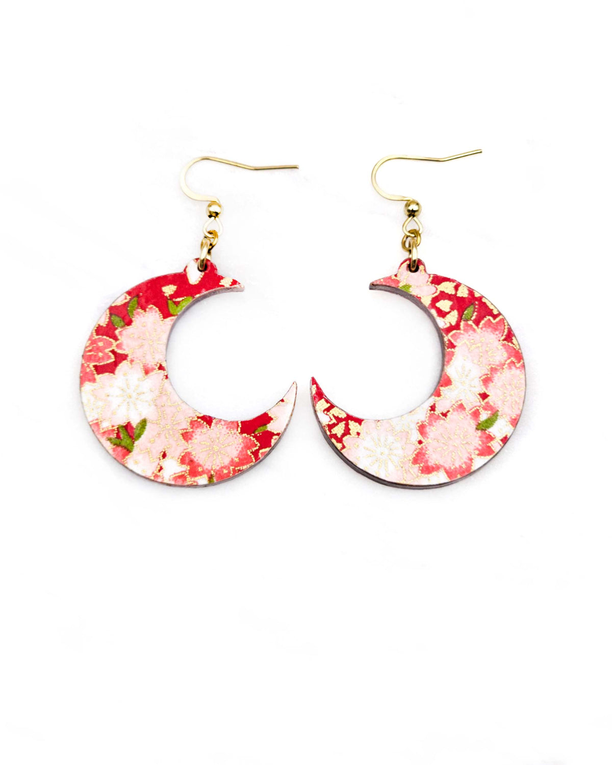 Medium wooden crescent moon shaped earrings featuring red and white cherry blossoms on a red background with metallic gold details.