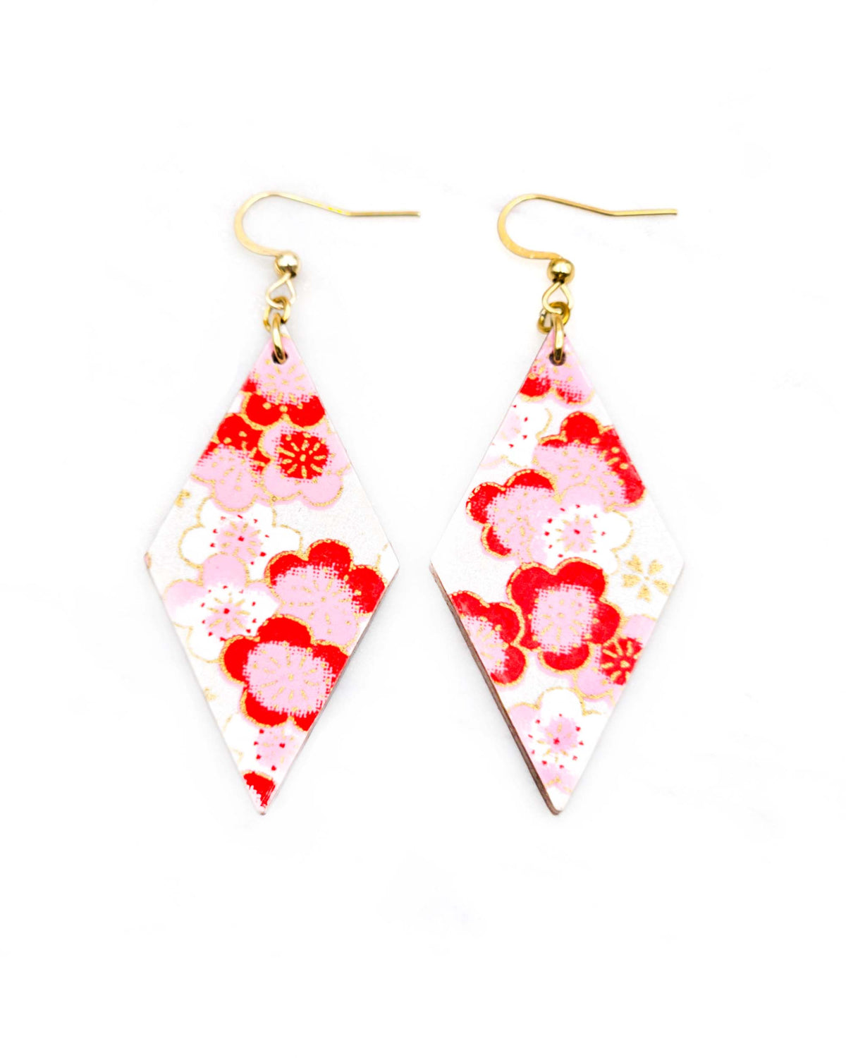 Medium wooden diamond shaped earrings featuring pink plum blossoms on a pearlescent white background with metallic gold accents.