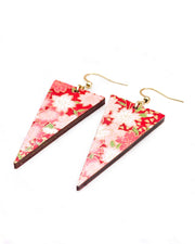 Medium wooden downward triangle shaped earrings featuring red and white cherry blossoms on a red background with metallic gold details.