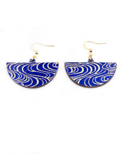 Medium wooden half circle shaped earrings featuring metallic gold water ripples on a dark blue background.
