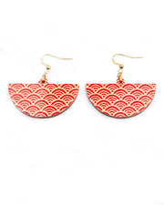 Medium wooden half circle shaped earrings featuring a traditional red and metallic gold seigaiha (wave crests) pattern