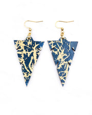 Medium wooden notched triangle shaped earrings featuring metallic gold fibers in the style of traditional unryu paper on a dark blue background.