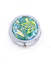 Silver metal pill box featuring a green and blue paisley design with metallic gold accents.