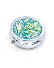Silver metal pill box featuring a green and blue paisley design with metallic gold accents.