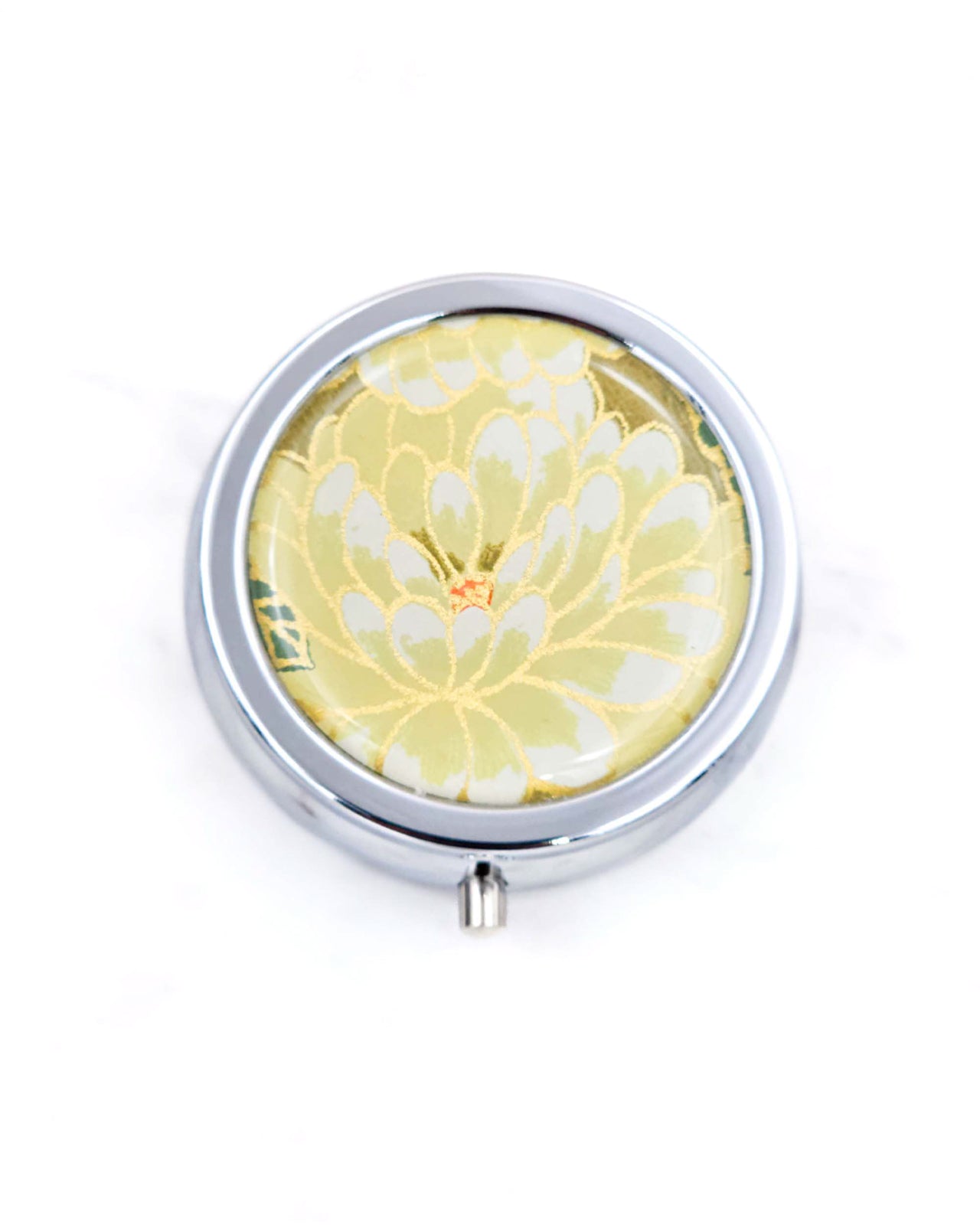 Silver metal pill box featuring a yellow chrysanthemum with metallic gold accents.