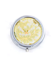 Silver metal pill box featuring a yellow chrysanthemum with metallic gold accents.