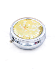 Silver metal pill box featuring a yellow chrysanthemum with metallic gold accents.
