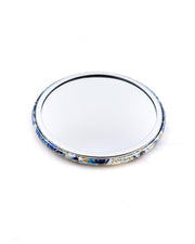 Round pocket mirror featuring blue and white cherry blossoms and maple leaves on a blue and white background with metallic gold accents.
