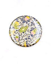 Round pocket mirror featuring pink, yellow, and green daffodil flowers on a gray background with metallic gold accents.