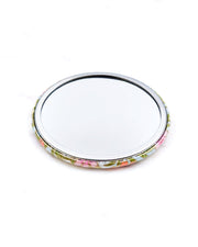 Round pocket mirror featuring pink and orange flower stalks on a light blue background with metallic gold accents.