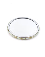 Round pocket mirror featuring a traditional gold asanoha (hemp leaf) design on a white background.
