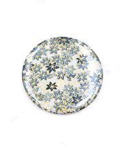 Round pocket mirror featuring gray and white maple leaves with metallic gold accents.