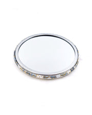 Round pocket mirror featuring gray and white maple leaves with metallic gold accents.