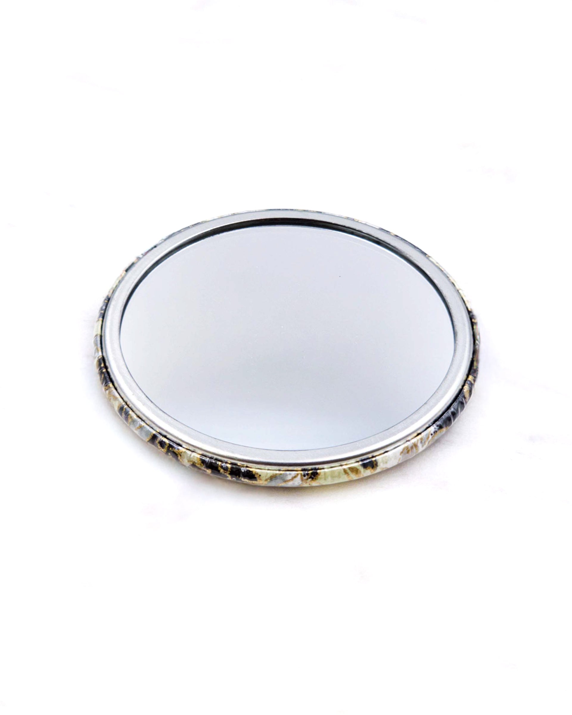 Round pocket mirror featuring gray and white cherry blossoms and other flowers on a gray and white background with metallic gold accents.