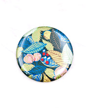 Round pocket mirror featuring yellow, blue, and green leaves and persimmons on a green background with metallic gold accents.