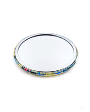 Round pocket mirror featuring yellow, blue, and green leaves and persimmons on a green background with metallic gold accents.