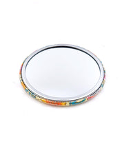 Round pocket mirror featuring orange and white flower stalks on a beige background with metallic gold accents.