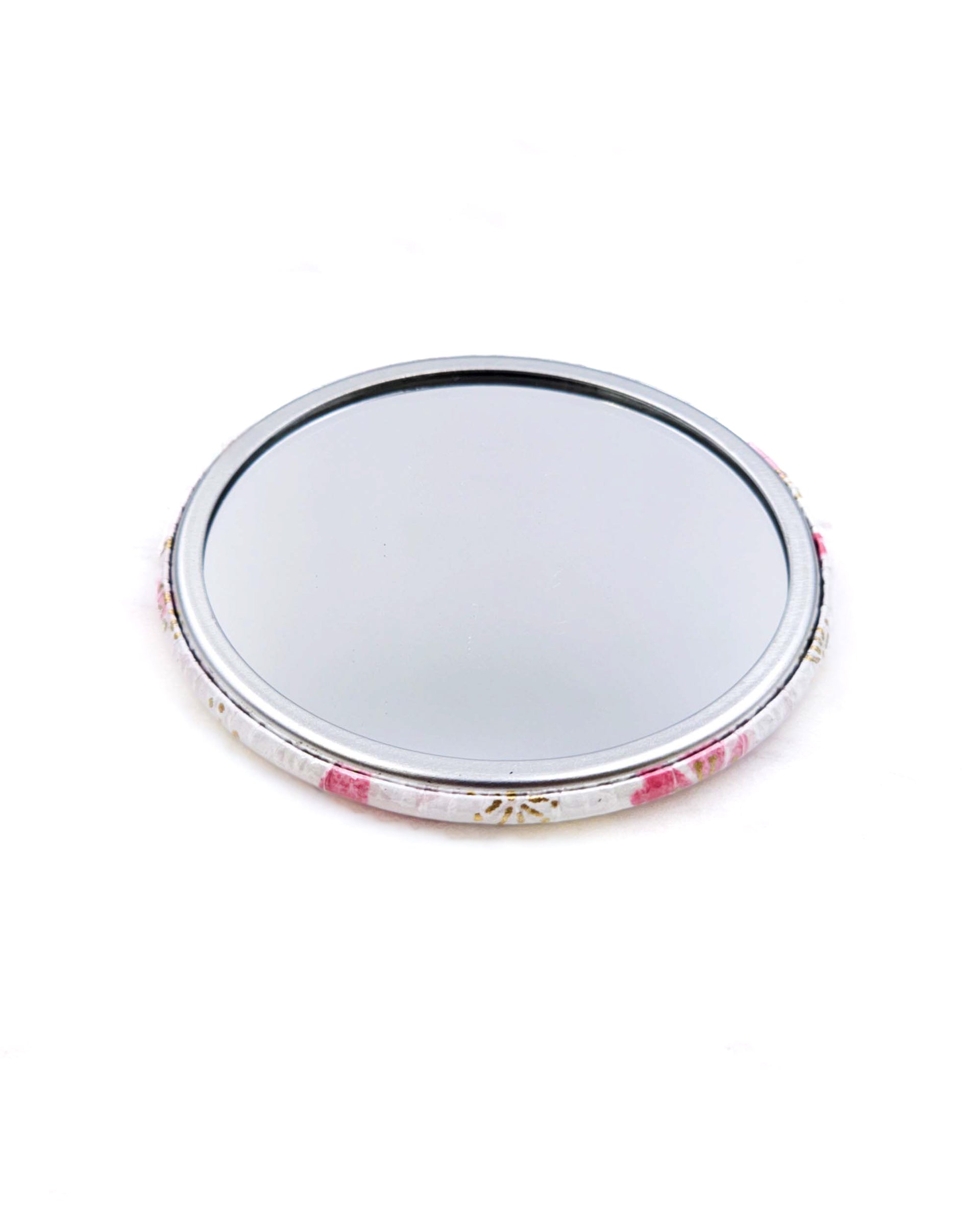 Round pocket mirror featuring pink and white cherry blossoms on a white background with metallic gold accents.