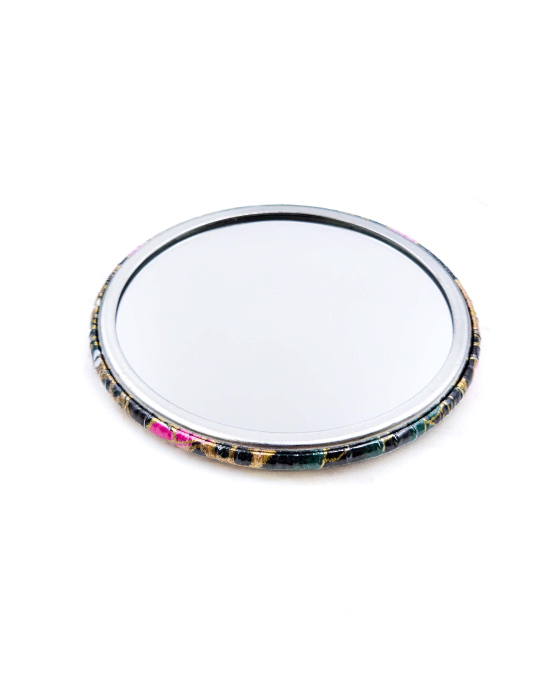 Round pocket mirror featuring pink and white plum blossoms on a black background with metallic gold accents.