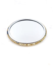 Round pocket mirror featuring cream plum blossoms and green bamboos on a metallic gold background.