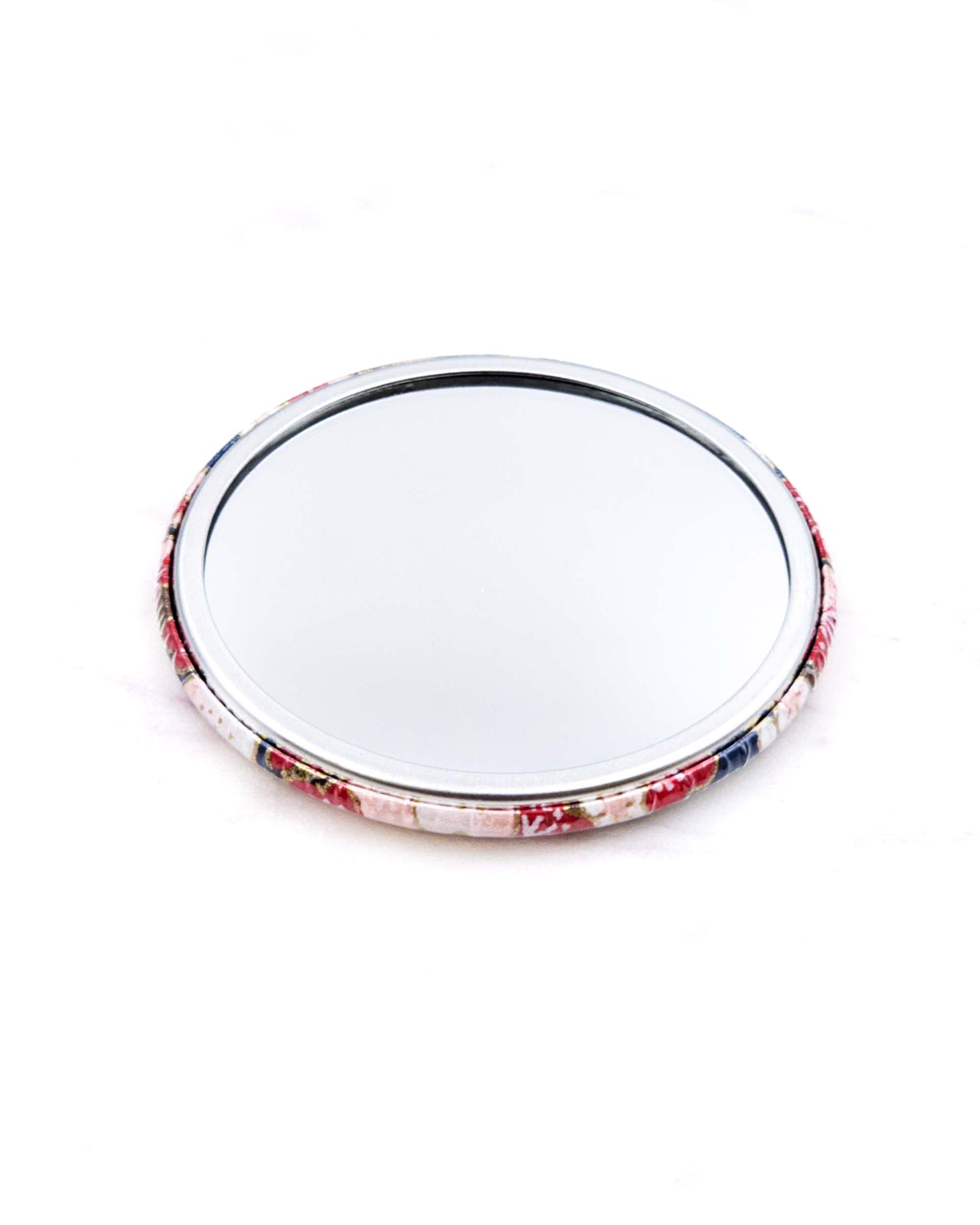 Round pocket mirror featuring a red plum blossom tree on a dark blue background with metallic gold accents.