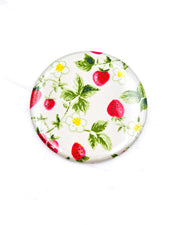 Round pocket mirror featuring strawberries and white flowers on a pearlescent white background.