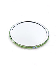 Round pocket mirror featuring small white and blue cherry blossoms on a pearlescent green background.