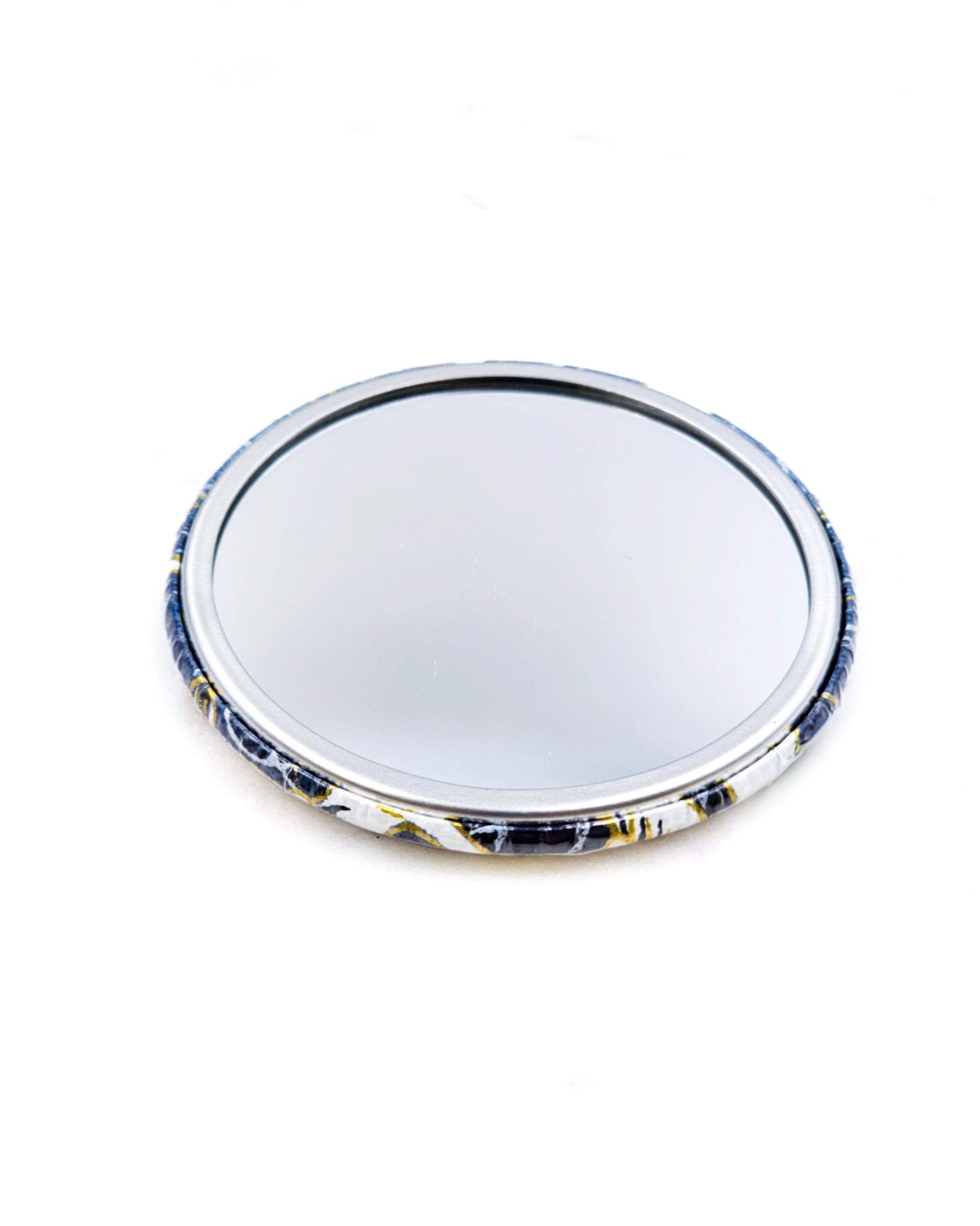 Round pocket mirror featuring white flying cranes on a dark blue background with metallic gold accents.