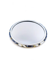 Round pocket mirror featuring white flying cranes on a dark blue background with metallic gold accents.