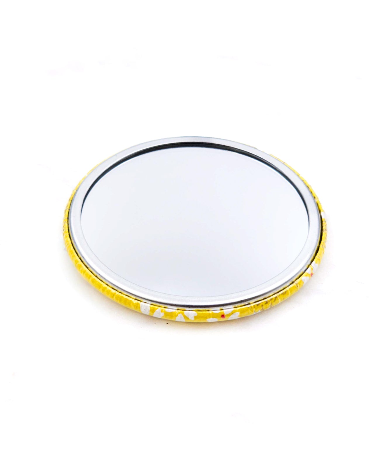 Round pocket mirror featuring small white and gold cherry blossoms on a yellow background with metallic gold accents.