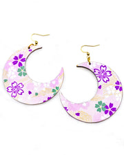 X-Large wooden Crescent Moon shaped earrings featuring purple, white, green, and pink cherry blossoms on a purple background with metallic gold details.