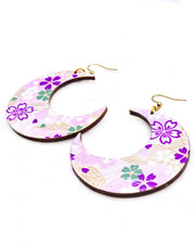 X-Large wooden Crescent Moon shaped earrings featuring purple, white, green, and pink cherry blossoms on a purple background with metallic gold details.