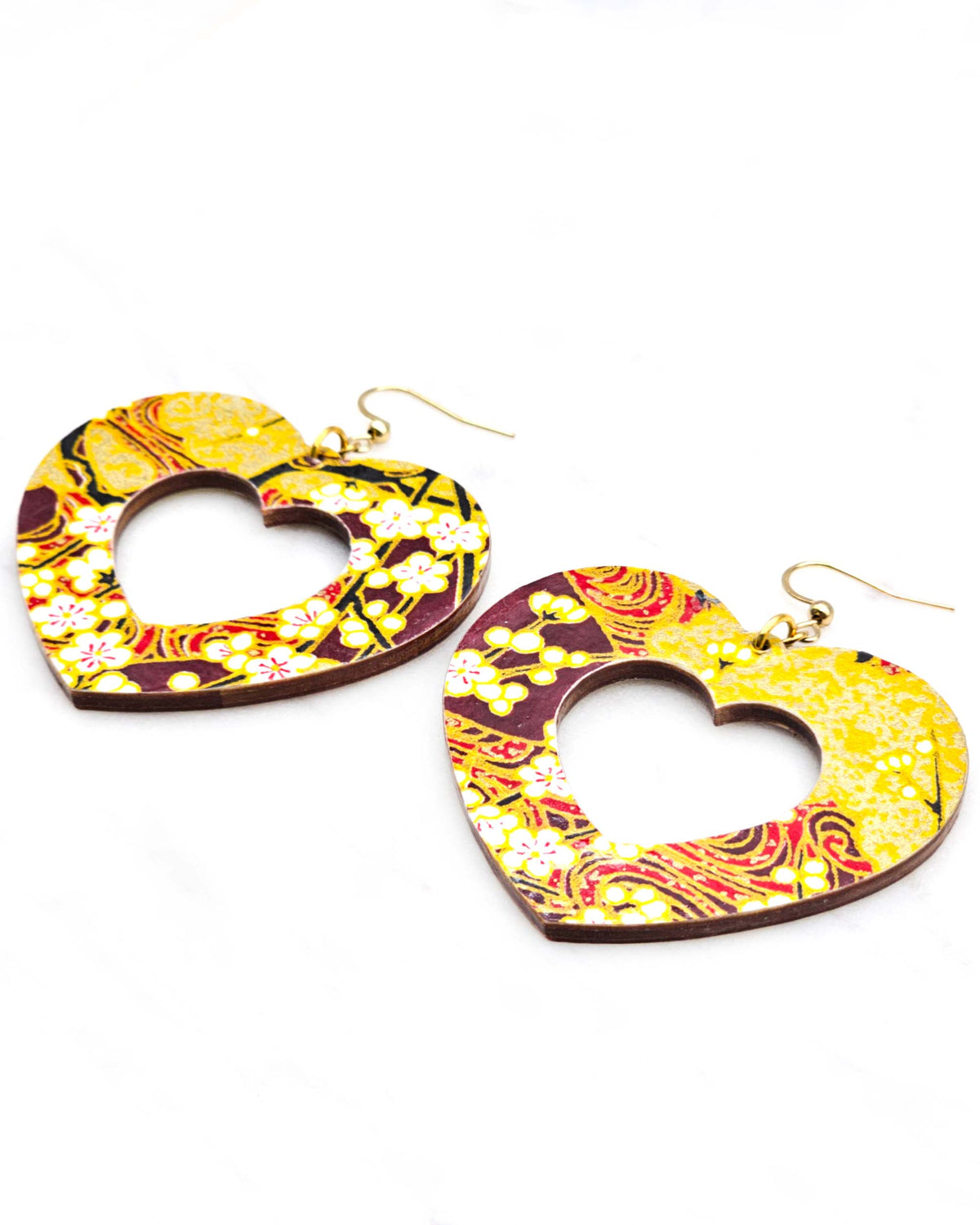 X-Large wooden hollow heart shaped earrings featuring white plum blossom branches on a maroon red and brown background with metallic gold details.