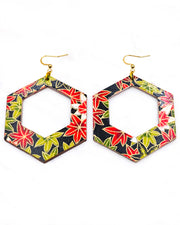 X-Large wooden hollow hexagon shaped earrings featuring red, green, and white maples leaves on a black background with metallic gold details.